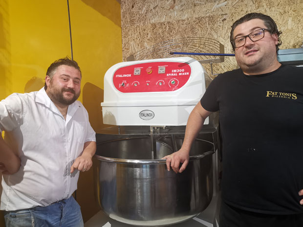 An enormous mixer helps the team keep up with demand for its delicious pizzas!