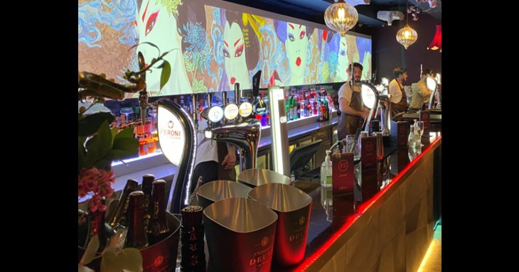 The new KIBOUsushi includes a dedicated bar with striking, moving digital artwork.