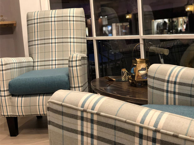 Comfy chairs and booths make the perfect environment for a cosy coffee