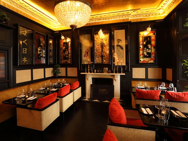 The chandeliers and a gilded gold ceiling create a stylish impact.