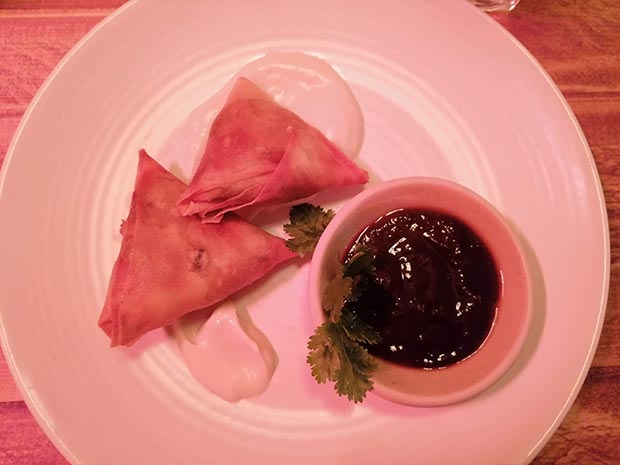 Indian-spiced samosas, filled with spiced potatoes, cashew nuts, sultanas, peas and coriander.