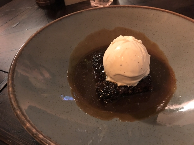 Sticky toffee pudding with ice cream.