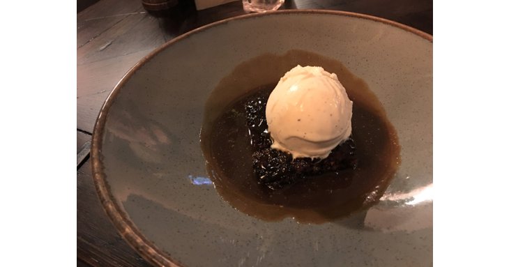 Sticky toffee pudding with ice cream.