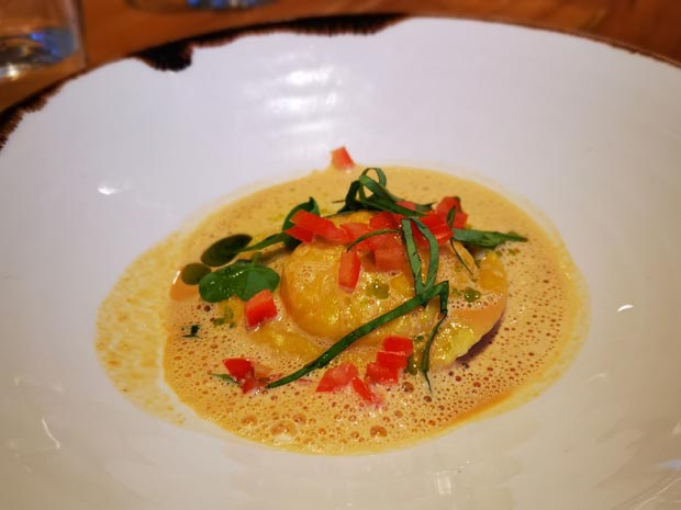 Crab and salmon ravioli with shellfish cappuccino.