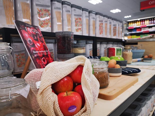 Customers can pick up reusable boxes and bags at the new unpacked store.