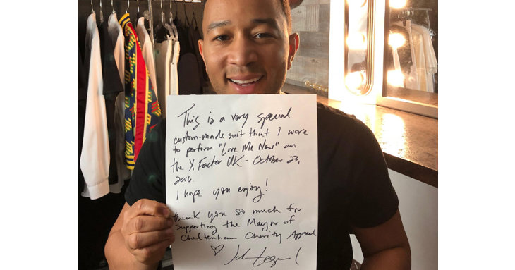 John Legend has donated a suit to help Gloucestershire charities.