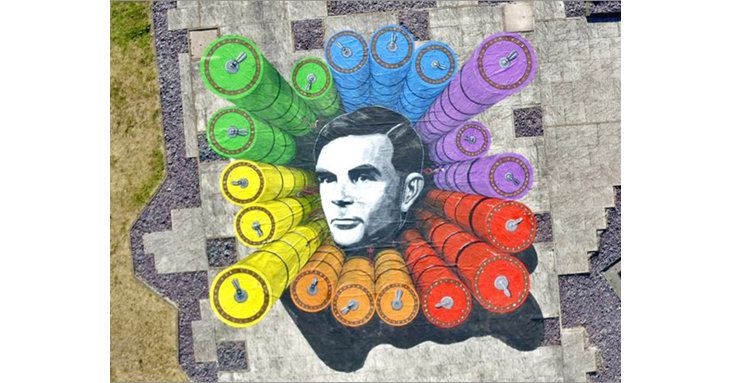Alan Turing played a vital role in breaking the German Enigma code and a huge rainbow-coloured canvas celebrating his legacy and birthday has appeared at GCHQ.