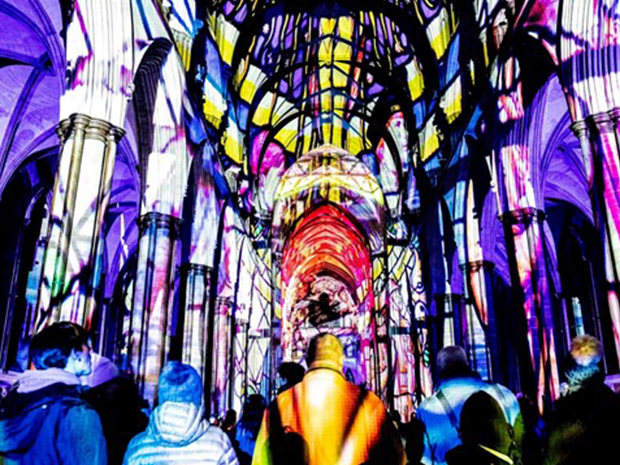 The 900-year-old Tewkesbury Abbey will be transformed by an immersive sound and light show at Tewkesbury Festival of Lights, this November 2021.  Luxmuralis Artistic Collaboration.