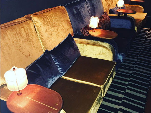 The cinema features sofa seats instead of traditional cinema seats