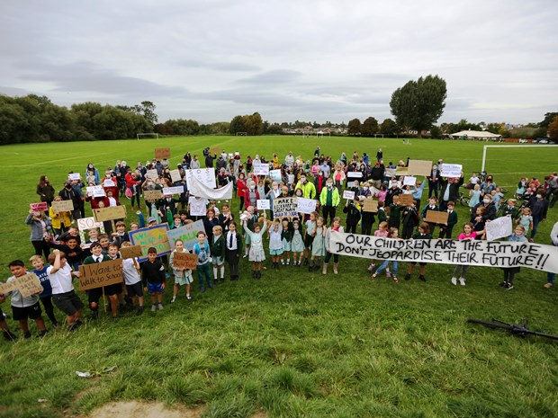 Around 200 gathered at Burrows Field to show support for the new Cheltenham senior school. &copy; Anna Lythgoe.