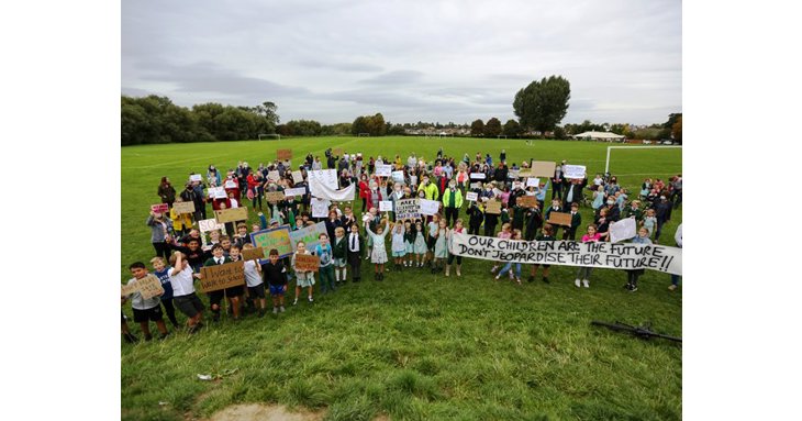 Around 200 gathered at Burrows Field to show support for the new Cheltenham senior school. &copy; Anna Lythgoe.