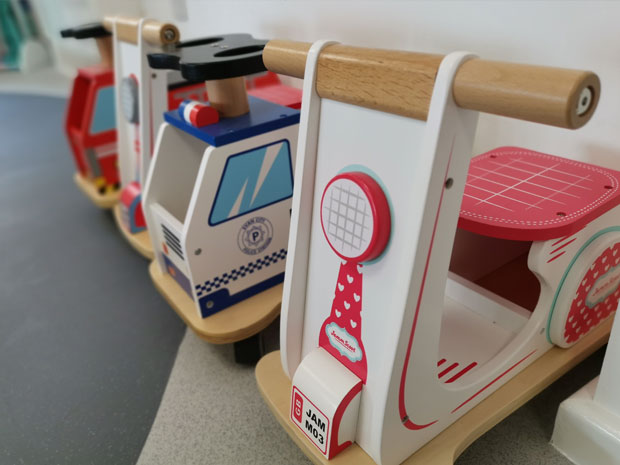 Dinky scooters are available for children to ride around Dinky Street