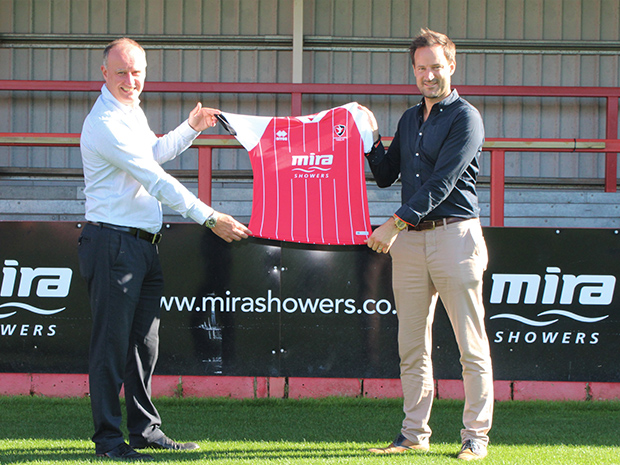 Mira Showers will continue as Cheltenham Towns front-of-shirt sponsor for two more years. Pictured left to right Craig Baker, managing director at Kohler Mira, and Paul Bence, commercial director at Cheltenham Town.