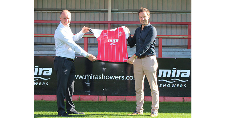 Mira Showers will continue as Cheltenham Towns front-of-shirt sponsor for two more years. Pictured left to right Craig Baker, managing director at Kohler Mira, and Paul Bence, commercial director at Cheltenham Town.