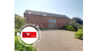 Situated in The Scarr, just outside Newent, this 16th century barn was converted into a modern home in 2007.