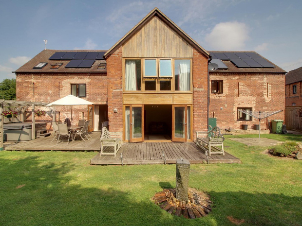 The spectacular rear garden is ideal for entertaining, with two decked patio areas, a pergola and neat lawns surrounded by mature shrubs and trees. Theres even space for a hot tub!