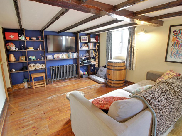 The family room offers a flexible space ideal for a playroom or additional lounge area.