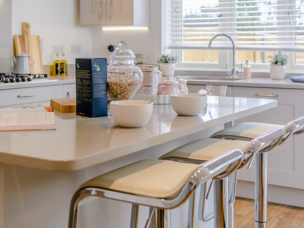 The stylish kitchen comes with Neff integrated appliances and a feature island.