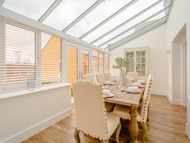 The open plan kitchen and family room leads onto a light, airy conservatory.
