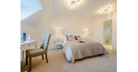 An ensuite and dressing room give the master bedroom a luxurious feeling.