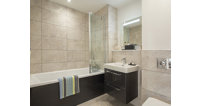 Both the main bathroom and ensuite are finished with ceramic tiles.