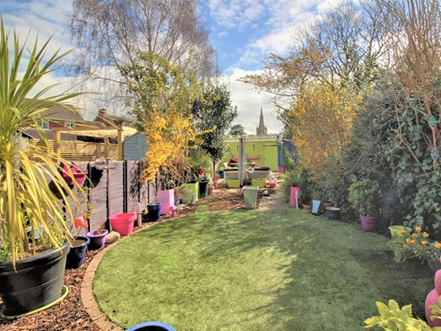 The outside space boasts a tidy lawn ideal for little ones, a patio and pergola for alfresco entertaining, as well as a workshop and parking for two cars.