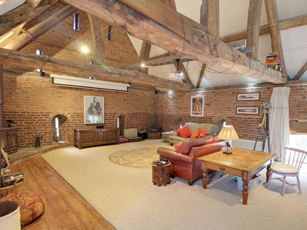 With dreamy exposed brickwork and a vaulted ceiling, the first-floor sitting room is truly spectacular.