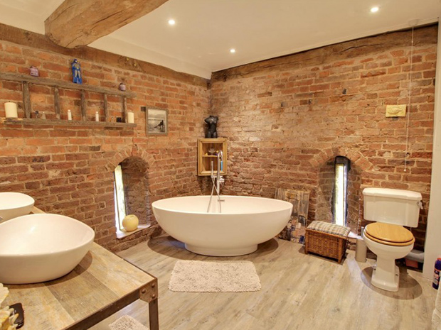 The family bathroom benefits from a freestanding bath and two wash basins.