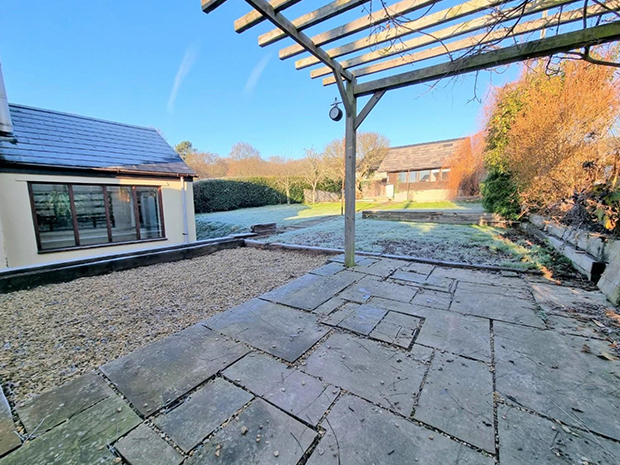 As well as a large garden, the property has an outbuilding which doubles up as a workshop and studio.