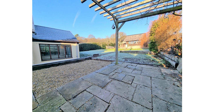 As well as a large garden, the property has an outbuilding which doubles up as a workshop and studio.