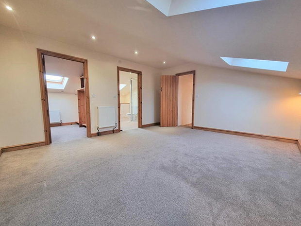 There are four bedrooms, with the master bedroom having its own ensuite shower room and a walk-in wardrobe.