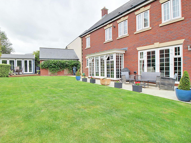 The rear garden itself is immaculate, with plenty of space for alfresco entertaining, as well as hedgerows providing privacy.