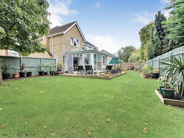 The well-kept garden has plenty of space for entertaining  and for kids to enjoy.