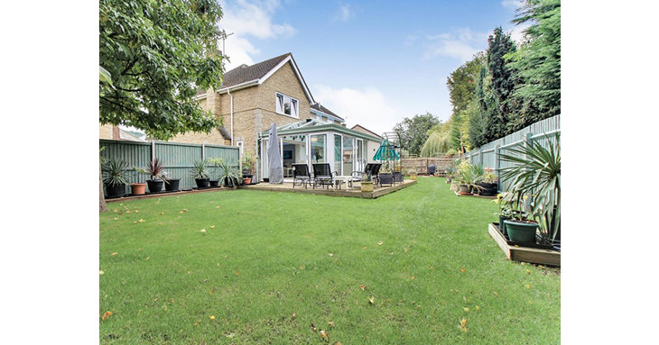 The well-kept garden has plenty of space for entertaining  and for kids to enjoy.