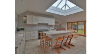 The expansive kitchen has a beautiful skylight lantern positioned over the main kitchen island.