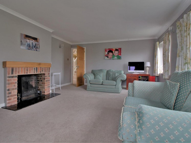 The property has a beautiful feature fireplace in the living room and an additional reception room leading to the conservatory.