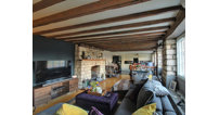 The property offers a spectacular living and dining space thats both cosy and modern.