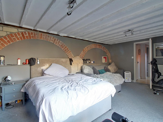 With four large bedrooms, including one on the ground floor with its own bifold doors to the patio, the living space suits large families and home workers.