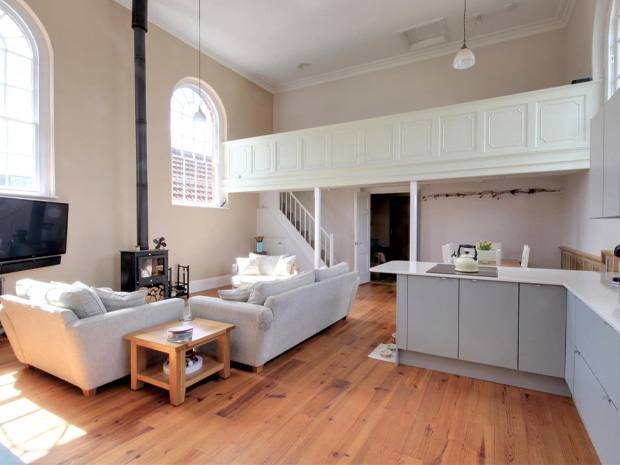 There's a light and spacious living area, with a mezzanine level overlooking the space.