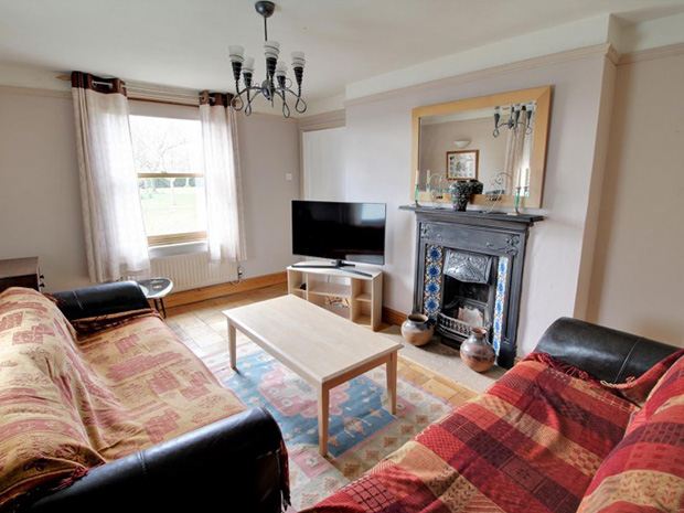 Downstairs, there are three reception rooms with lovely character features.