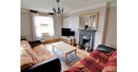 Downstairs, there are three reception rooms with lovely character features.