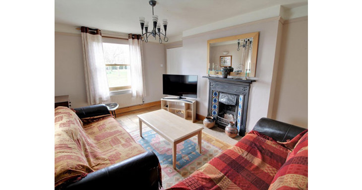 Downstairs, there are three reception rooms with lovely character features.