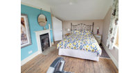 On the first floor, there are three good size bedrooms with lovely views and a large family bathroom.