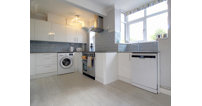 It benefits from a modern kitchen with high gloss cupboards, lots of worktop space and plenty of room for appliances.