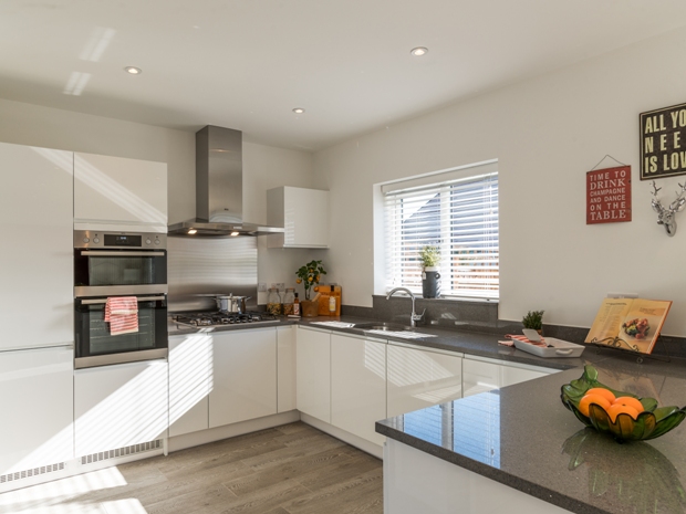 The kitchen comes complete with integrated appliances.