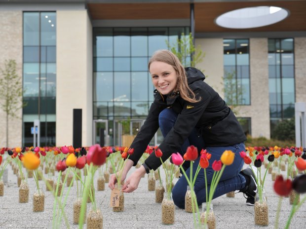Each one of the 4,500 hand-carved wooden tulips in the Garden of Gratitude bears a note from someone naming and thanking a charity close to their heart.