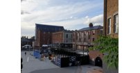 The site of Gloucester Food Dock, overlooking the Victoria Basin, where various waterside buildings are currently being transformed into a new foodie destination.
