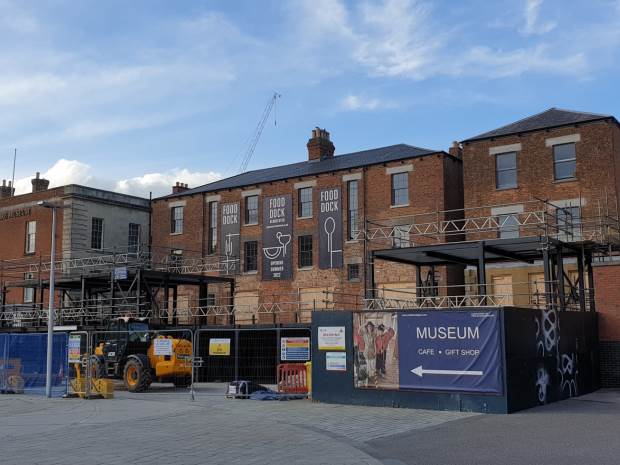 The site of Gloucester Food Dock, overlooking the Victoria Basin, where various waterside buildings are currently being transformed into a new foodie destination.