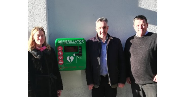 Clare Seed, of Public Hearts Cheltenham Defibrillator Campaign, David Evans, of Evans Jones, and Rob Howse, of The Brewery Quarter, with one of the new public-access defibrillators.
