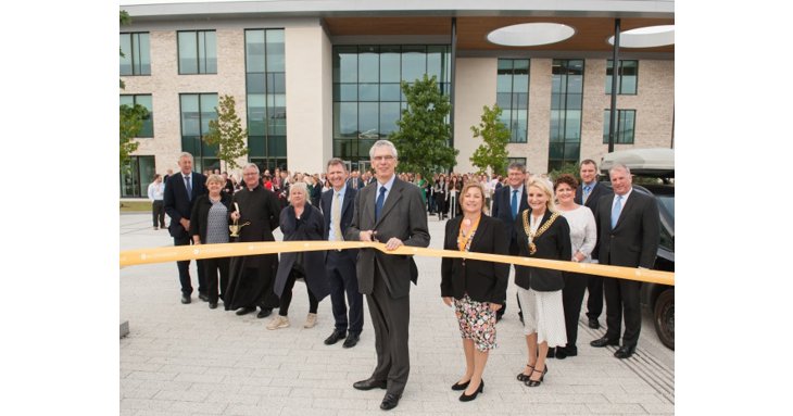 Tim Carroll, chairman of Allchurches Trust, cuts the ribbon to officially open the new Ecclesiastical office building, Benefact House, on Gloucester Business Park. Image by Pixel PR Photography.